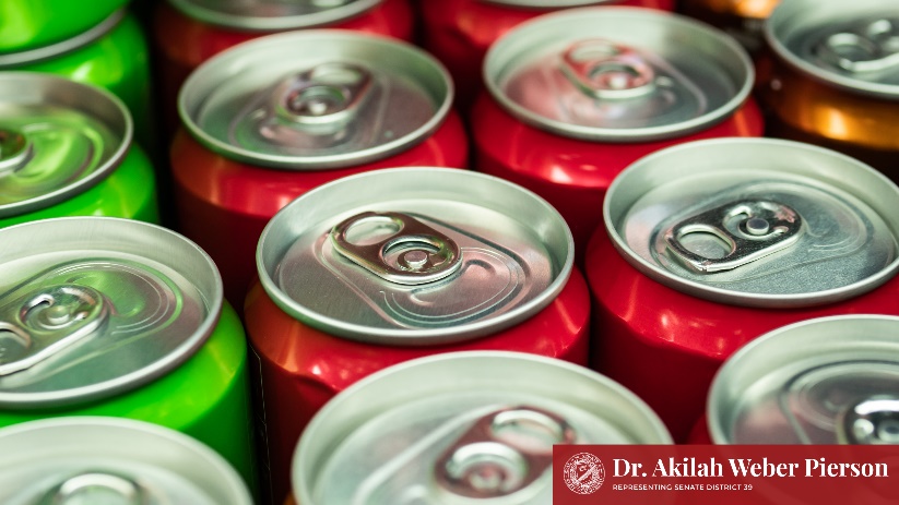 An image of the tops of several aluminum cans. 