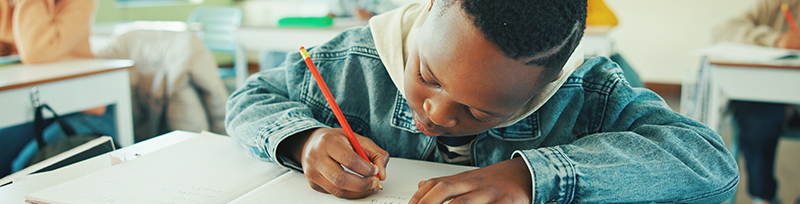 a child writing on paper